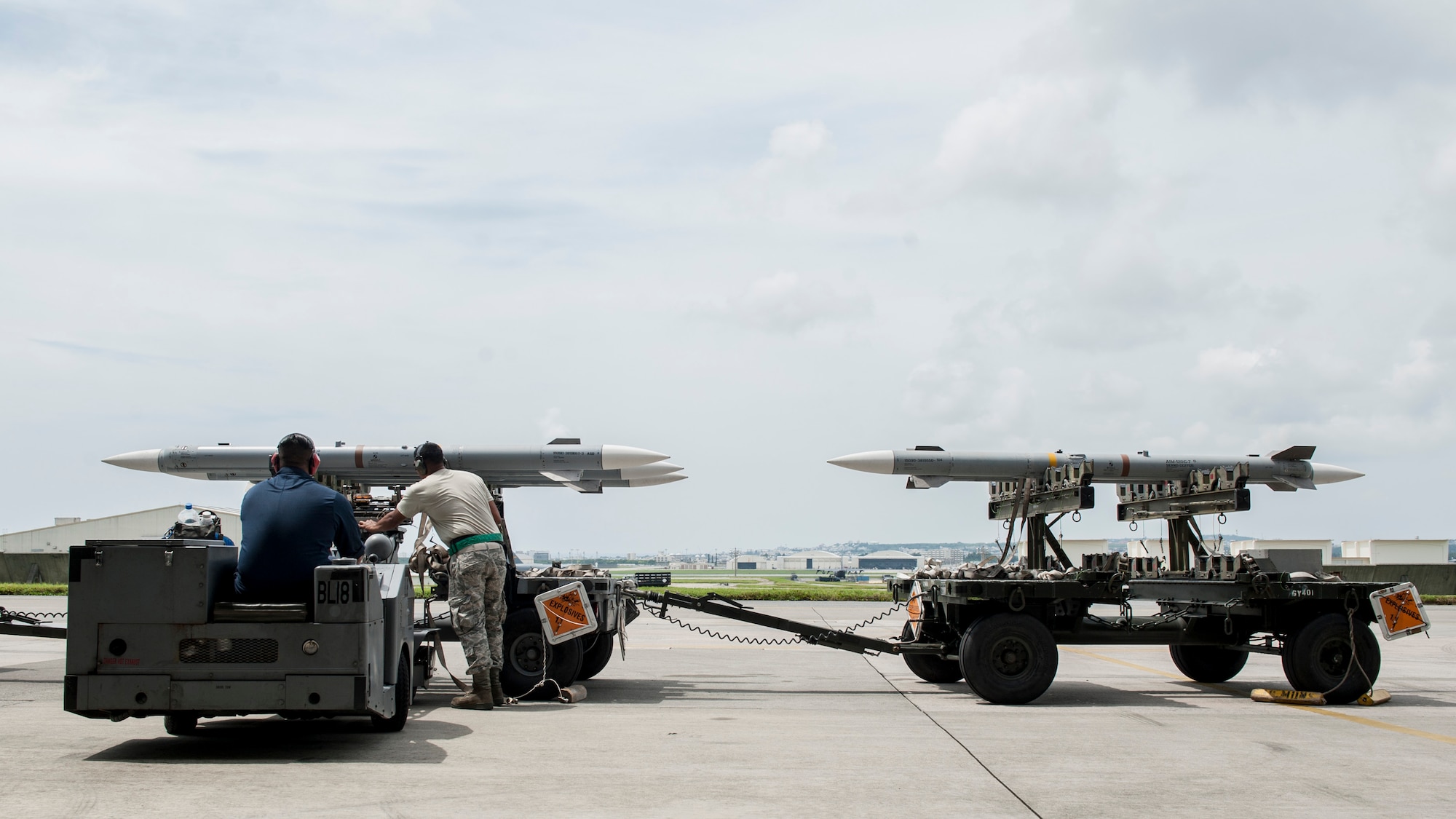 Maintainers from the 18th Aircraft Maintenance Squadron and pilots assigned to the 44th and 67th Fighter Squadrons conduct a mass aircraft generation exercise Aug. 22 and 23, at Kadena Air Base, Japan. Maintainers loaded AIM-9 sidewinder missiles, AIM-120 advanced medium-range air-to-air missiles, flares, and M-61A1 cannon rounds onto F-15 Eagles, before the aircraft taxied and were dispersed around the flight line. Kadena participates in a variety of routine training exercises throughout the year to maintain a consistent high standard of readiness and expertise. F-15s assigned to Kadena Air Base taxied on the flight line during a training exercise Aug. 23 while loaded with live ammunition. This training was not in response to or in anticipation of any regional concerns. While no planes took off from the flightline, this routine exercise helped ensure Kadena’s ability to provide air superiority in the defense of Japan and promoting peace and stability throughout the Indo-Asia-Pacific region. (U.S. Air Force photo by Senior Airman Peter Reft/Released)
