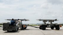 Maintainers from the 18th Aircraft Maintenance Squadron and pilots assigned to the 44th and 67th Fighter Squadrons conduct a mass aircraft generation exercise Aug. 22 and 23, at Kadena Air Base, Japan. Maintainers loaded AIM-9 sidewinder missiles, AIM-120 advanced medium-range air-to-air missiles, flares, and M-61A1 cannon rounds onto F-15 Eagles, before the aircraft taxied and were dispersed around the flight line. Kadena participates in a variety of routine training exercises throughout the year to maintain a consistent high standard of readiness and expertise. F-15s assigned to Kadena Air Base taxied on the flight line during a training exercise Aug. 23 while loaded with live ammunition. This training was not in response to or in anticipation of any regional concerns. While no planes took off from the flightline, this routine exercise helped ensure Kadena’s ability to provide air superiority in the defense of Japan and promoting peace and stability throughout the Indo-Asia-Pacific region. (U.S. Air Force photo by Senior Airman Peter Reft/Released)
