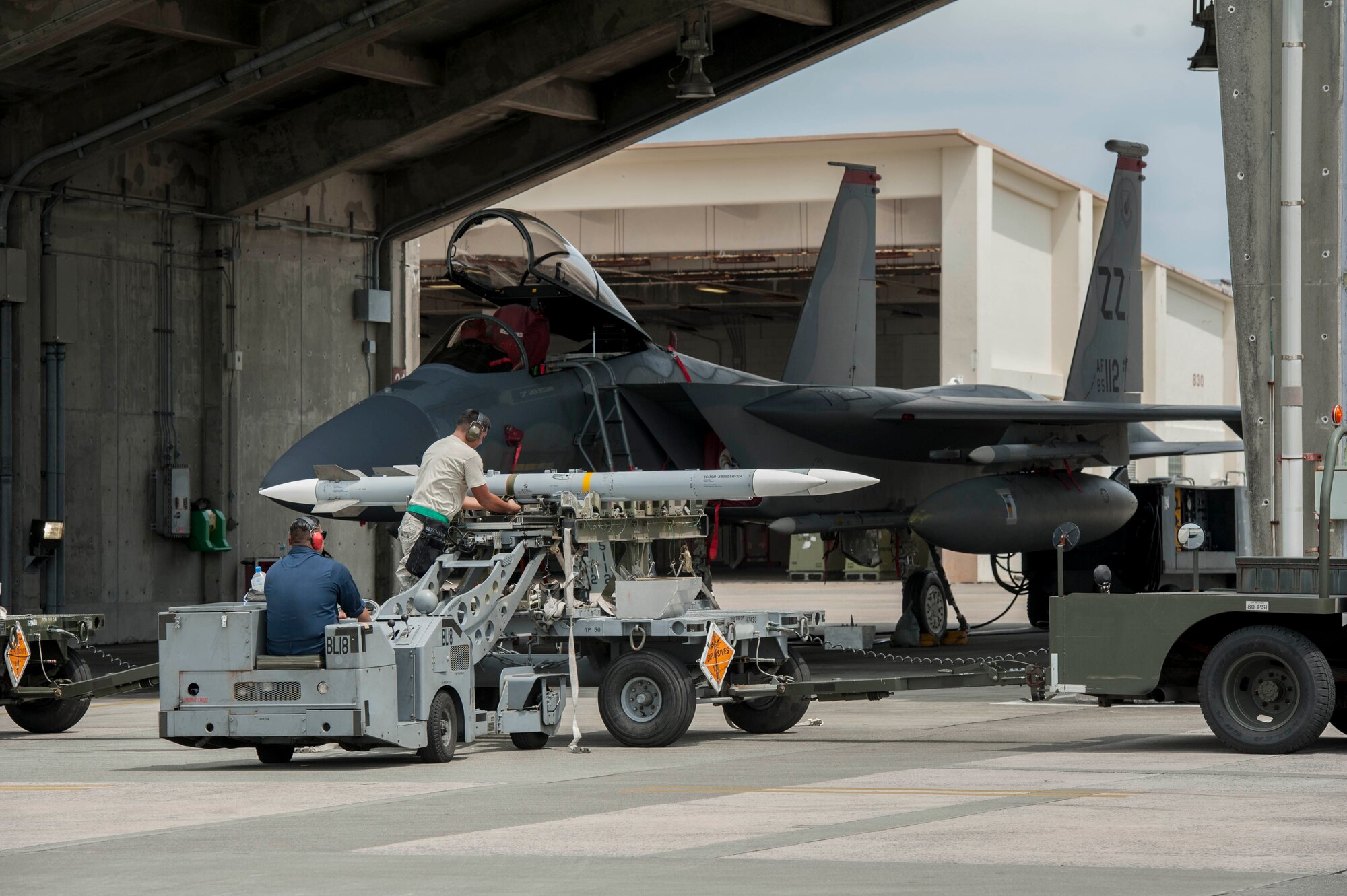 Maintainers from the 18th Aircraft Maintenance Squadron and pilots assigned to the 44th and 67th Fighter Squadrons conduct a mass aircraft generation exercise Aug. 22 and 23, at Kadena Air Base, Japan. Maintainers loaded AIM-9 sidewinder missiles, AIM-120 advanced medium-range air-to-air missiles, flares, and M-61A1 cannon rounds onto F-15 Eagles, before the aircraft taxied and were dispersed around the flight line. Kadena participates in a variety of routine training exercises throughout the year to maintain a consistent high standard of readiness and expertise. F-15s assigned to Kadena Air Base taxied on the flight line during a training exercise Aug. 23 while loaded with live ammunition. This training was not in response to or in anticipation of any regional concerns. While no planes took off from the flightline, this routine exercise helped ensure Kadena’s ability to provide air superiority in the defense of Japan and promoting peace and stability throughout the Indo-Asia-Pacific region. (U.S. Air Force photo by Senior Airman Peter Reft/Released)
