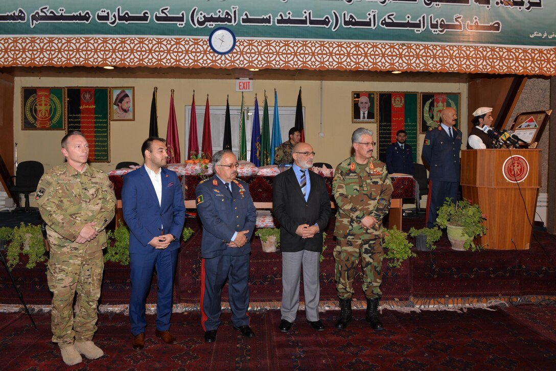 Brig. Gen. David Hicks, Train, Advise, Assist Command-Air (TAAC-Air) and 438th Expeditionary Wing commander, stands as part of the official party during a ceremony celebrating the Afghan air force's 95th birthday at Kabul Air Wing, Afghanistan, Aug. 24, 2016. Members of TAAC-Air attended the ceremony marking the historic occasion. TAAC-Air advisors work shoulder to shoulder with AAF members to strengthen the AAF’s war fighting capabilities. (U.S. Air Force photo by Tech. Sgt. Christopher Holmes)