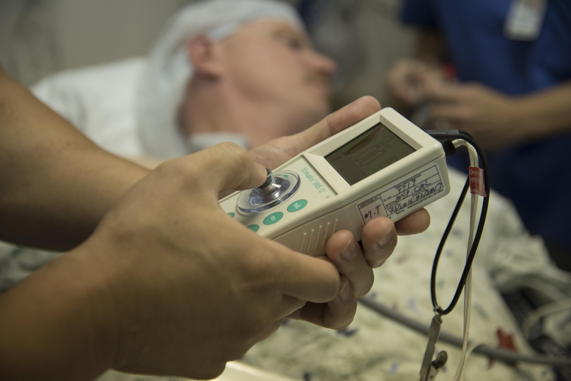 U.S. Air Force Capt. Edward Ha, a registered nurse and anesthetist assigned to the 35th Medical Group, tests the nerve blockage in a patient’s right arm with a nerve stimulant during MEDEX 16, a medical exercise held at Misawa Air Base, Japan, Aug. 25, 2016. The nerve stimulant verifies the correct area that surgeons need to operate on as well as provides less pain for the patient post-surgery. (U.S. Air Force photo by Airman 1st Class Sadie Colbert)