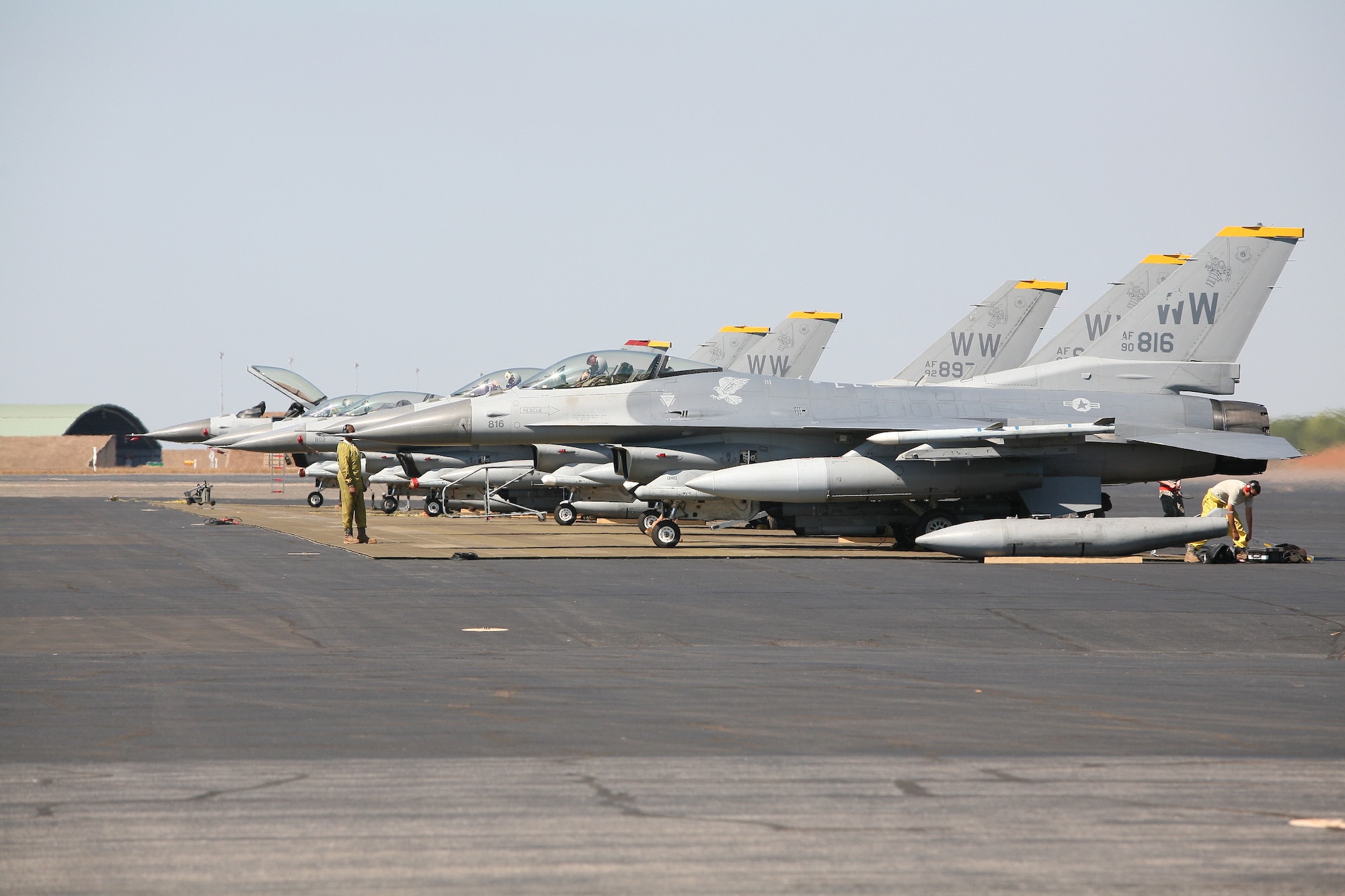 A line of F-16 Fighting Falcons from the 14th Fighter Squadron, Misawa Air Base, Japan, complete flying operations during exercise Pitch Black 16 at Royal Australian Air Force Darwin, Aug. 10, 2016. Pitch Black 16 was designed to foster closer military ties between participating nations, allow for mutually beneficial training in a complex air environment, and establish a better understanding between militaries in the Indo-Asia-Pacific region. (Courtesy photo by Royal Australian Air Force)

