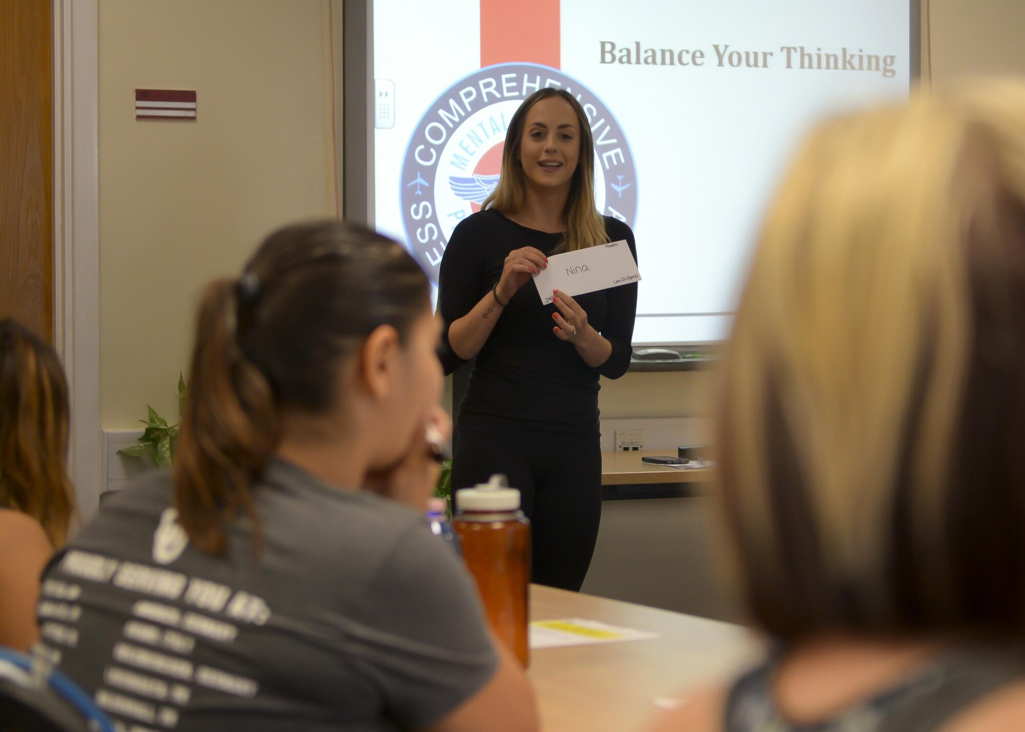Nina Goolsby, RAF Mildenhall Spouse Resilience Team member, conducts an ice-breaker exercise during the “Spouses on Belay” event Aug. 19, 2016, on RAF Mildenhall, England. The lessons imparted during the event were taught by spouses, for spouses with the goal to train them to continually strive to achieve and maintain a well-balanced lifestyle. (U.S. Air Force photo by Staff Sgt. Victoria H. Taylor)