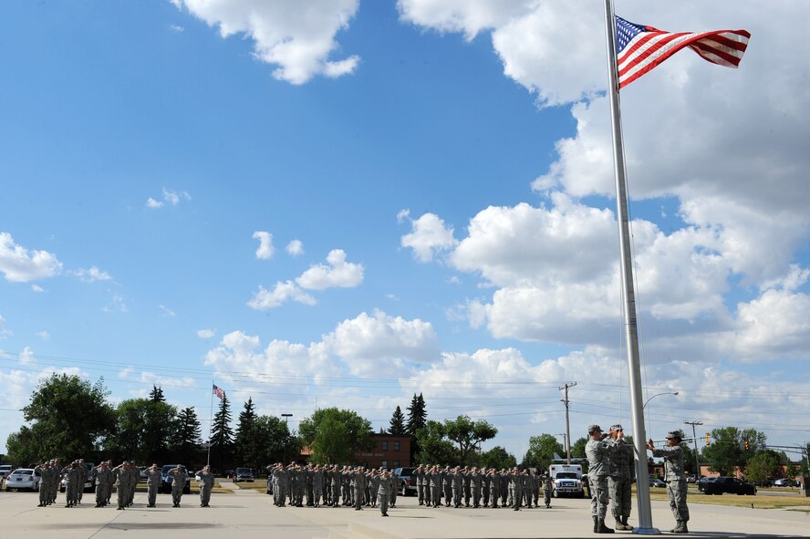 On Aug. 16, 2016, Team Minot’s senior-enlisted leaders organized a retreat ceremony which included the Chief’s Group, First Sergeant Council and Senior Non-Commissioned Officer Professional Enhancement seminar students. The retreat ceremony signals the end of the official duty day and serves as a ceremony for paying respect to the flag. (U.S. Air Force photo/Senior Airman Kristoffer Kaubisch)