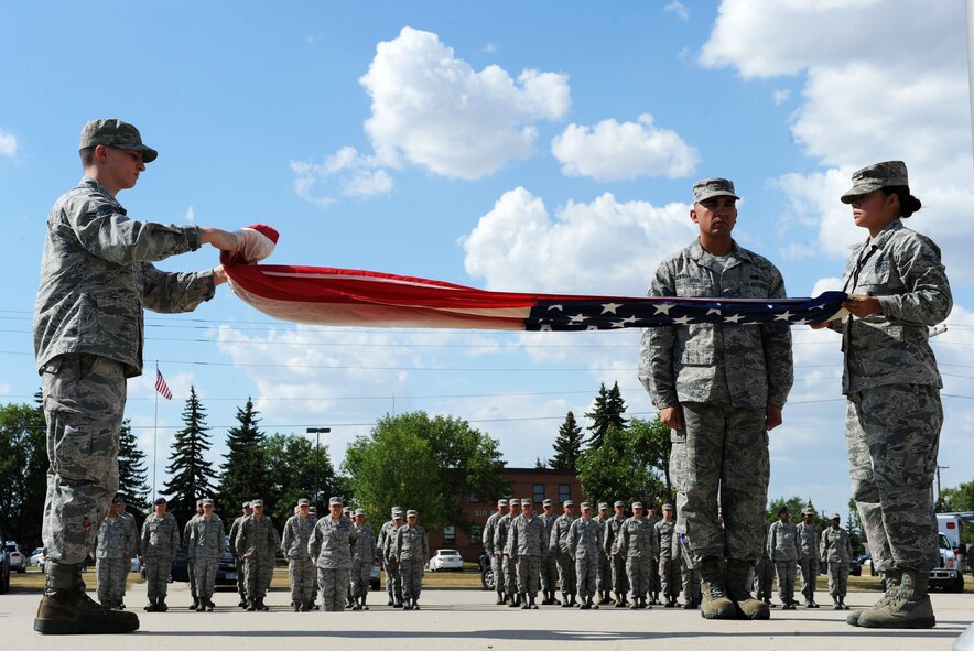 On Aug. 16, 2016, Team Minot’s senior-enlisted leaders organized a retreat ceremony which included the Chief’s Group, First Sergeant Council and Senior Non-Commissioned Officer Professional Enhancement seminar students. The retreat ceremony signals the end of the official duty day and serves as a ceremony for paying respect to the flag. (U.S. Air Force photo/Senior Airman Kristoffer Kaubisch)