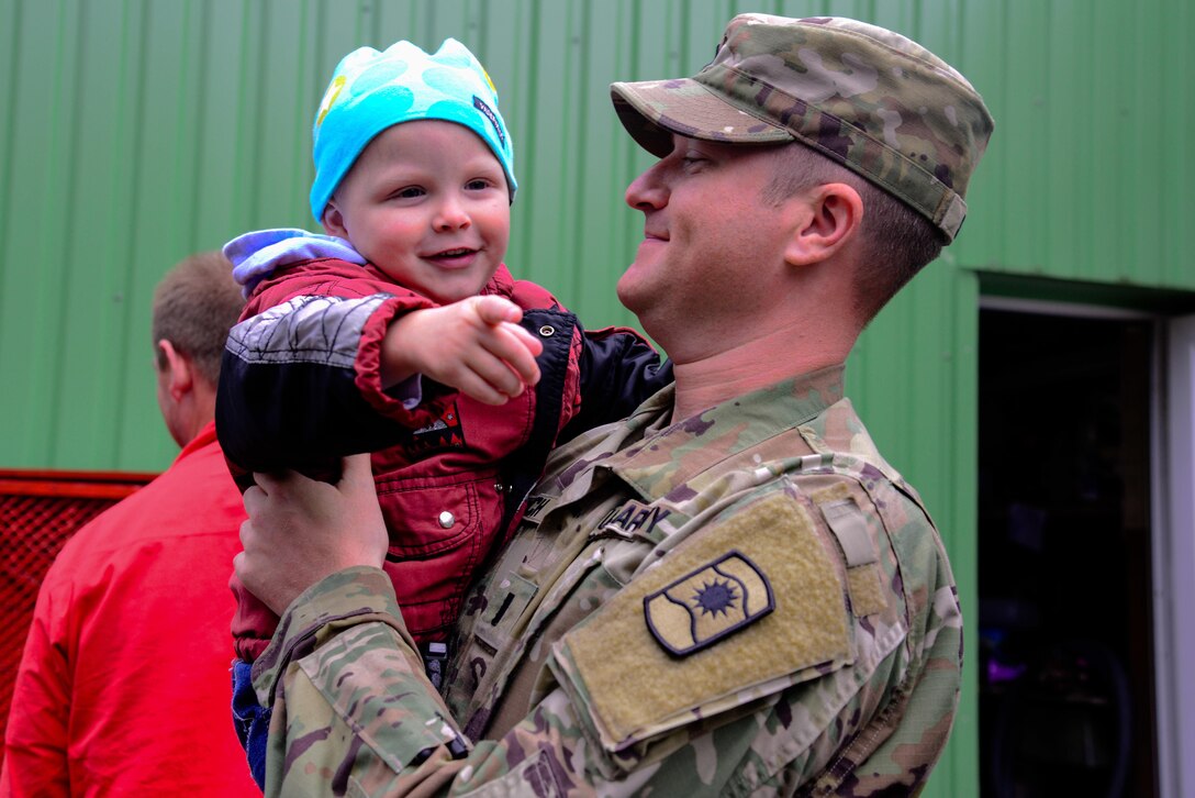 U.S. Army 1st Lt. John Sorich, assigned to Alpha Company, 457th Civil Affairs Battalion, 361st Civil Affairs Brigade, 7th Mission Support Command, holds a child from Kudikiu Namai during a Humanitarian Civil Assistance (HCA) project in Sauliai, Lithuania, Aug. 18, 2016. As part of the European Command’s (EUCOM) Humanitarian and Civic Assistance Program, the 375th Engineer Company, 457th Civil Affairs Battalion and the Lithuanian military collaborate to renovate the fence at Kudikiu Namai, an orphanage for Lithuanian children up to the age of 6, in Sauliai, Lithuania, August 8-26, 2016. The Humanitarian and Civic Assistance Program is a series of medical and engineering engagements in several European countries in support of strategic, theater, operational and tactical objectives. (U.S. Army photo by Pfc. Emily Houdershieldt)