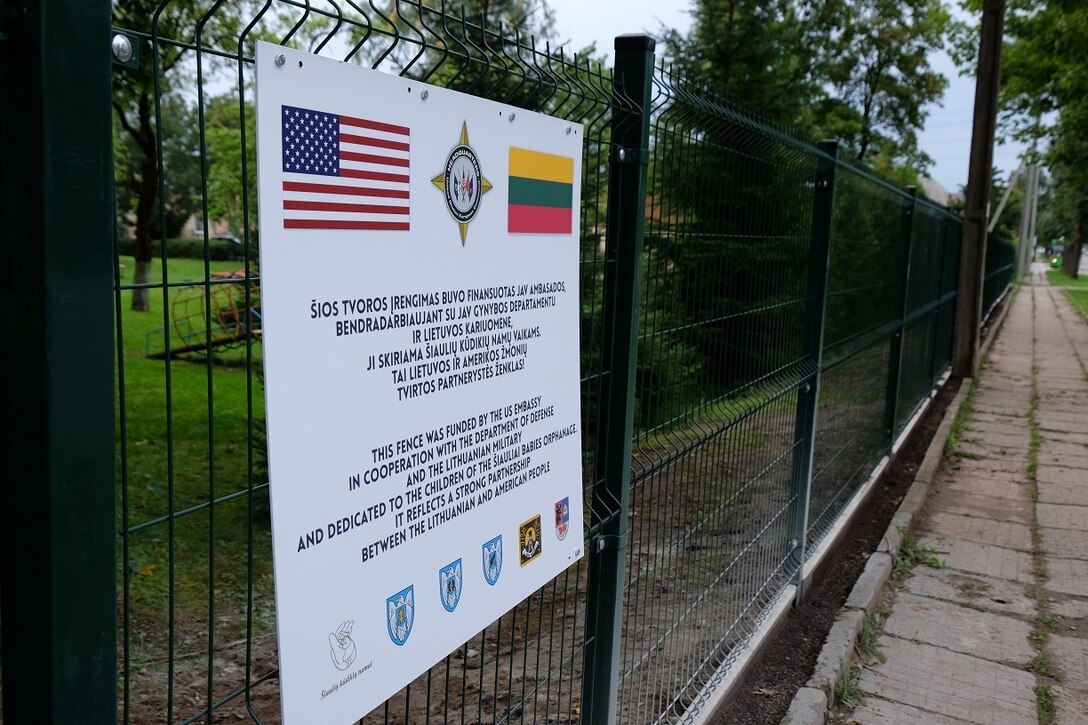 SIAULIAI, Lithuania – Army Reserve Soldiers from the 7th Mission Support Command helped coordinate the construction of a new fence and gate and sign for the local ‘infant’ or ‘baby’ orphanage with USAR Soldiers from the 412th Theater Engineer Command and Lithuanian Soldiers and Airmen and local national contractors, Aug. 8-25, 2016. 