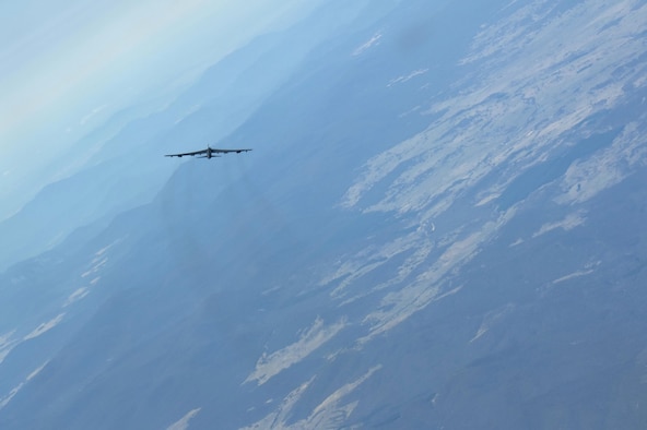 A U.S. Air Force B-52H Stratofortress returning from deployment at Andersen Air Force Base, Guam, flies over the 50th Anniversary of the Battle of Long Tan and Vietnam Remembrance Day ceremony at Canberra, Australia, Aug. 18, 2016. At the request of the Australian government, two Pacific Air Forces B-52s already scheduled to fly a training mission in support of exercise Pitch Black, supported the event commemorating the U.S. and Australia's strong alliance during the Vietnam War that continues to this day. (U.S. Air Force photo by Staff Sgt. Sandra Welch)