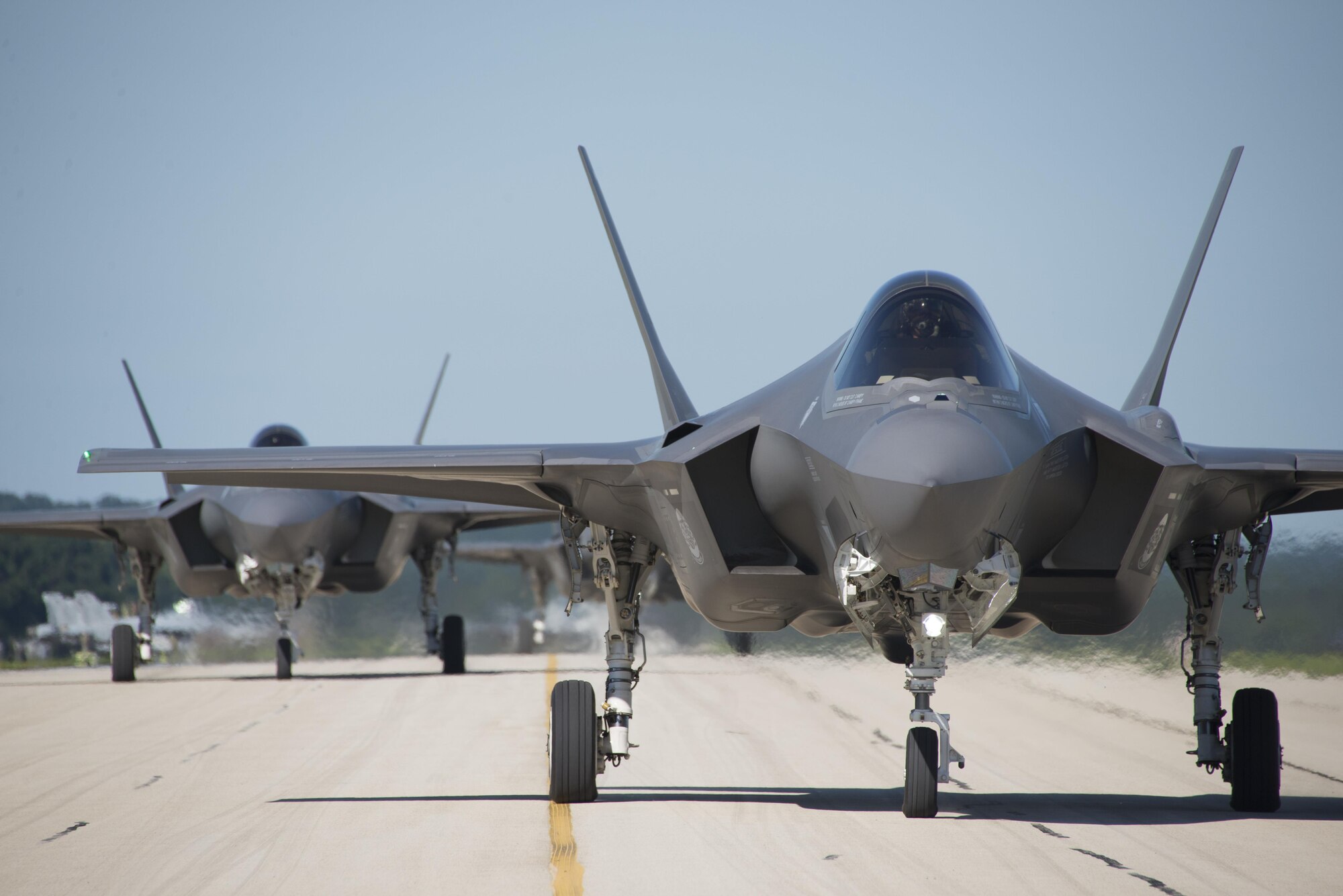 F-35A Lightning IIs from the 33rd Fighter Wing taxi down the flightline at Volk Field, Wis., during Northern Lightning, Aug. 22, 2016. Northern Lightning is a tactical-level, joint training exercise that emphasizes fifth- and fourth-generation assets engaged in a contested, degraded environment. (U.S. Air Force photo/Senior Airman Stormy Archer)
