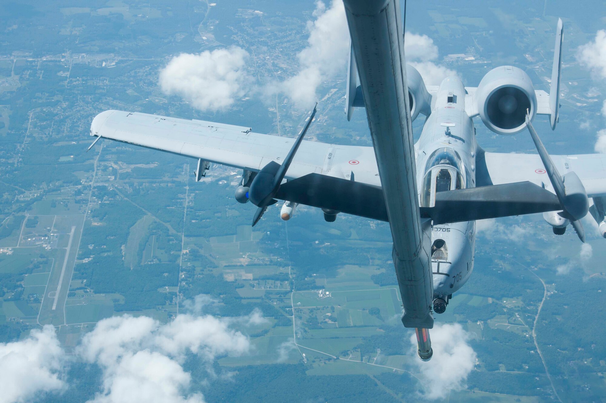 An A-10 Thunderbolt II makes its way toward the boom of KC-10 Extender to receive fuel during a local training flight above Maryland Aug. 20. The Air Force Reserve tanker aircrew assigned to the 514th Air Mobility Wing at Joint Base McGuire-Dix-Lakehurst, here, met up with the Air National Guard pilots from the 104th Fighter Squadron for an opportune practice mission. The KC-10's boom operator controls refueling operations through a digital, fly-by wire system. Sitting in the rear of the aircraft, the operator can see the receiver aircraft through a wide window. During boom refueling operations, fuel is transferred to the receiver at a maximum rate of 1,100 gallons (4,180 liters) per minute. (U.S. Air Force photo/1st Lt. Emily Rautenberg)