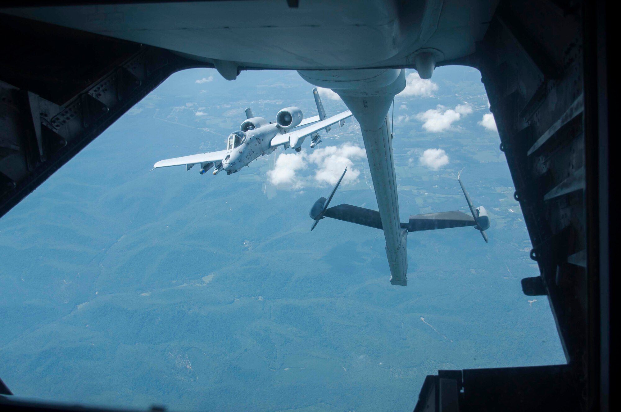 An A-10 Thunderbolt II breaks away from a KC-10 Extender after receiving fuel during a local training flight above Maryland Aug. 20. The Air Force Reserve tanker aircrew assigned to the 514th Air Mobility Wing at Joint Base McGuire-Dix-Lakehurst, here, met up with the Air National Guard pilots from the 104th Fighter Squadron for an opportune practice mission. The KC-10's boom operator controls refueling operations through a digital, fly-by wire system. Sitting in the rear of the aircraft, the operator can see the receiver aircraft through a wide window. During boom refueling operations, fuel is transferred to the receiver at a maximum rate of 1,100 gallons (4,180 liters) per minute. (U.S. Air Force photo/1st Lt. Emily Rautenberg)