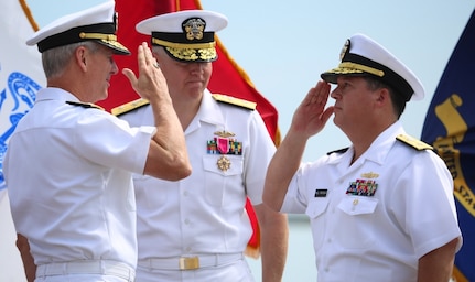 DAHLGREN, Va. (Aug. 25, 2016) - Rear Adm. Tom Druggan, right, commander, Naval Surface Warfare Center, salutes Vice Adm. Thomas Moore, commander, Naval Sea Systems Command, during a change of command ceremony. Druggan relieved Rear Adm. Lorin Selby, center, as NSWC commander at the first change of command ceremony held on the NSWC Dahlgren Division Potomac River Test Range gunline.