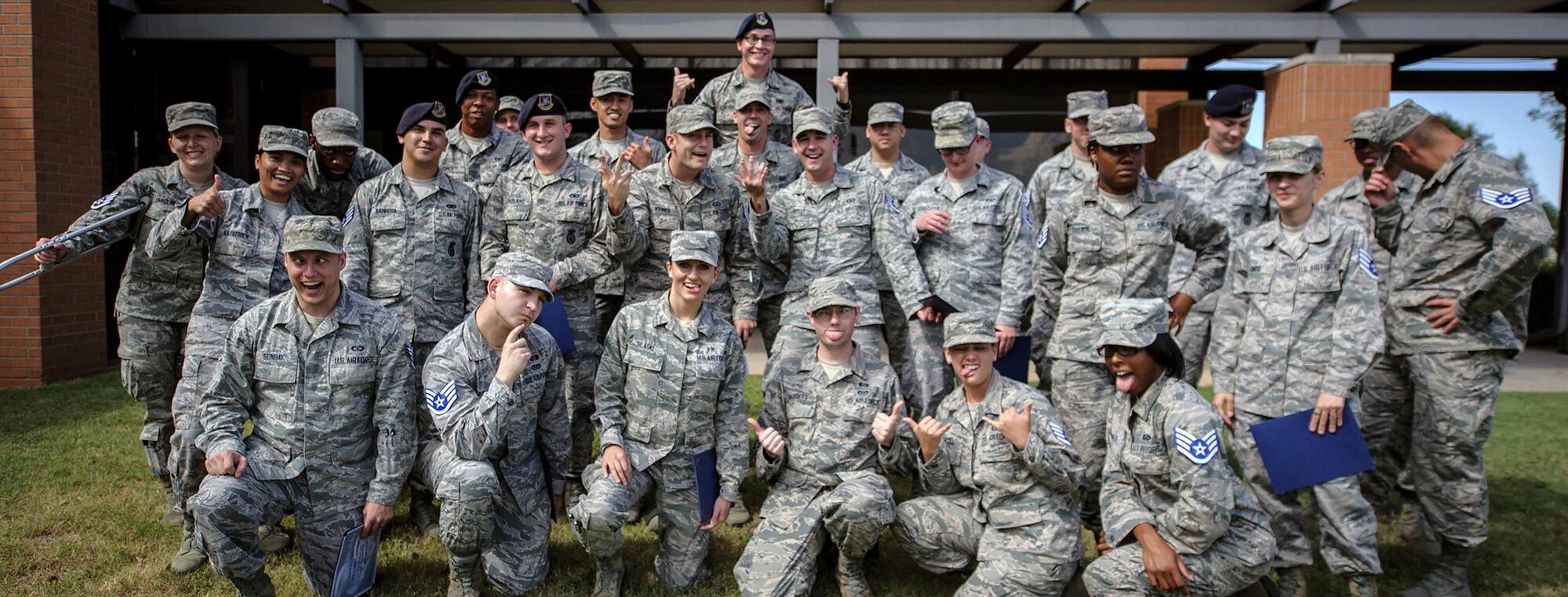 Staff sergeant selects celebrate the good news outside the Collocated Club at Vance Air Force Base, Oklahoma, Aug. 25. They were among 16,506 senior airmen Air Force wide selected for promotion to the first of the noncommissioned officer ranks. (U.S. Air Force photo/ David Poe)