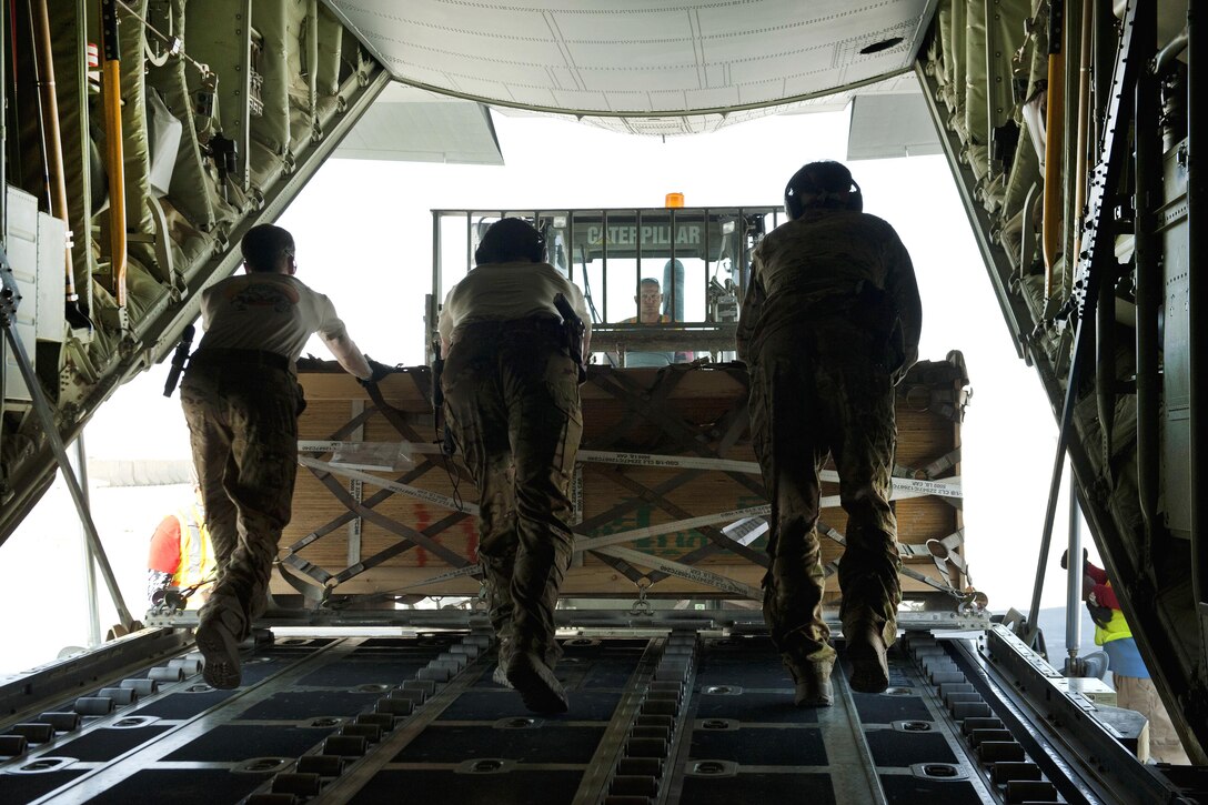 Air Force loadmasters offload a pallet of cargo from a C-130J Super Hercules at Camp Dwyer in Afghanistan, Aug. 19, 2016. Air Force photo by Capt. Korey Fratini