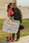 Capt. Zachary Proud, 69th Bomb Squadron co-pilot, poses with a loved one at Minot Air Force Base, N.D., Aug. 23, 2016. Proud and other 69th BS Airmen returned from a six-month deployment. (U.S. Air Force photo/Senior Airman Apryl Hall)