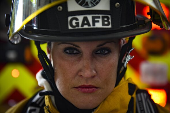Krystell Clemons, 17th Civil Engineer Squadron firefighter, dons her bunker gear at the 17th CES Fire Emergency Services fire department on Goodfellow Air Force Base, Texas, Aug. 24, 2016. Krystell represents the women throughout history who’ve broken the mold and historical standards for the observation of Women’s Equality Day Aug. 26. (U.S. Air Force photo by Airman 1st Class Caelynn Ferguson/Released)