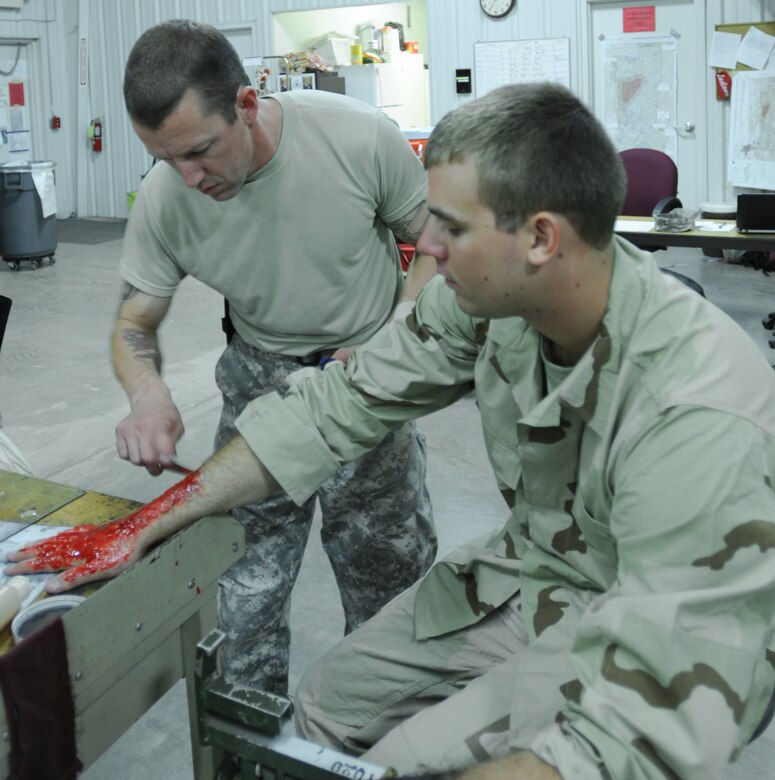 FORT MCCOY, Wis -- Sgt. Dallas Francois, a health care specialist from the 5501st U.S. Army Hospital out of San Antonio, Texas, applies cosmetics to imitate a wound on Spc. Eric Effertz, a carpentry and masonry specialist from the 327th Engineer Company out of Onalaska, Wis., during the Global Medic Exercise at Fort McCoy, Wis. on Aug. 19, 2016. Global Medic is an inter-service training event that develops and evaluates the collective skills of Army Reserve Soldiers and other service members in a collaborative environment. (U.S. Army Reserve photo by Spc. Christopher A. Hernandez, 345th Public Affairs Detachment)