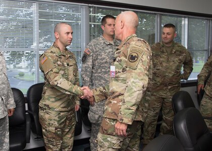 During his first ever tour of Japan, LTG Charles D. Luckey (right), commanding general, United States Army Reserve Command, shakes hands with Capt. James D. Morris (left), operations officer, Army Reserve Engagement Team-Japan, Aug 24, 2016, Camp Zama, Japan. Luckey visited Japan to understand the close partnership between USARJ and the Army Reserve. Luckey’s tour also gave Morris, a native of Nashville, Tennessee, and his ARET-J team members a rare opportunity to discuss ARET-J’s recent achievements, current challenges and future opportunities directly to the chief. (U.S. Army photo by Yuichi Imada, U.S. Army Garrison-Japan)