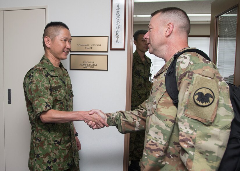 U.S. Army Command Sgt. Maj. James P. Wills (right), interim command sergeant major, United States Army Reserve Command, shakes hands with Japan Ground Self-Defense Warrant Officer Makoto Yahara (left), JGSDF Ground Staff Office liaison officer to U.S. Army Japan, Aug. 24, 2016, in Camp Zama, Japan. For the first time in their military careers, Wills and LTG Charles D. Luckey, chief, U.S. Army Reserve, visited Japan to understand the close partnership between USARJ and the Army Reserve. Their short yet informative tour also gave the Army Reserve’s most senior leaders a rare opportunity to directly engage with Soldiers working and training in Japan and promote the Army Reserve’s new vision in the Pacific. (U.S. Army photo by Yuichi Imada, U.S. Army Garrison-Japan)