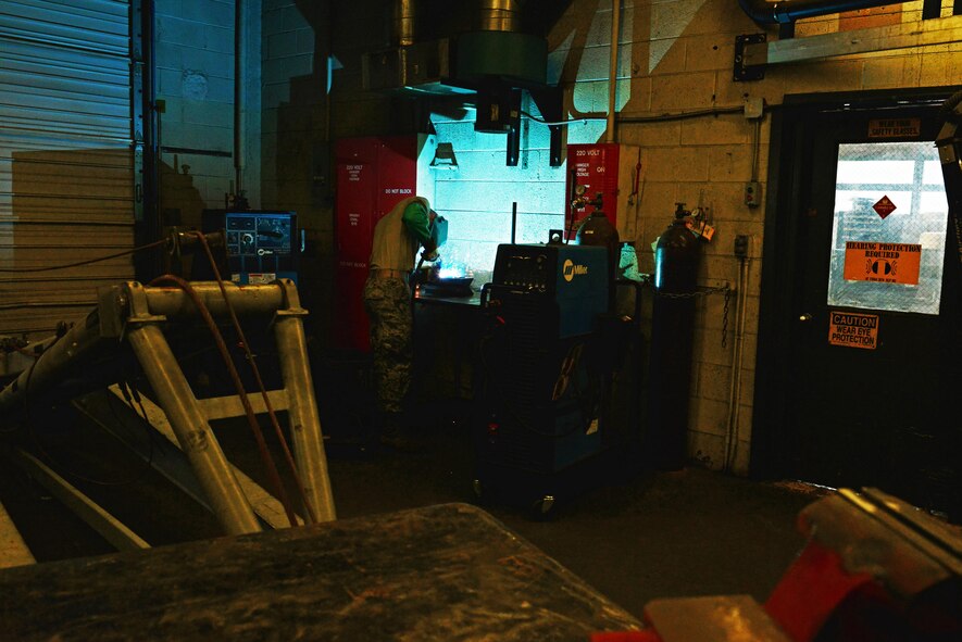 U.S. Air Force Airman 1st Class Mason Carney, 20th Equipment Maintenance Squadron aircraft metals technology apprentice, welds metal together at Shaw Air Force Base, S.C., Aug. 23, 2016. Metals technology Airmen learn different types of welding, including metal inert gas and tungsten inert gas welding. (U.S. Air Force photo by Airman 1st Class Destinee Sweeney)
