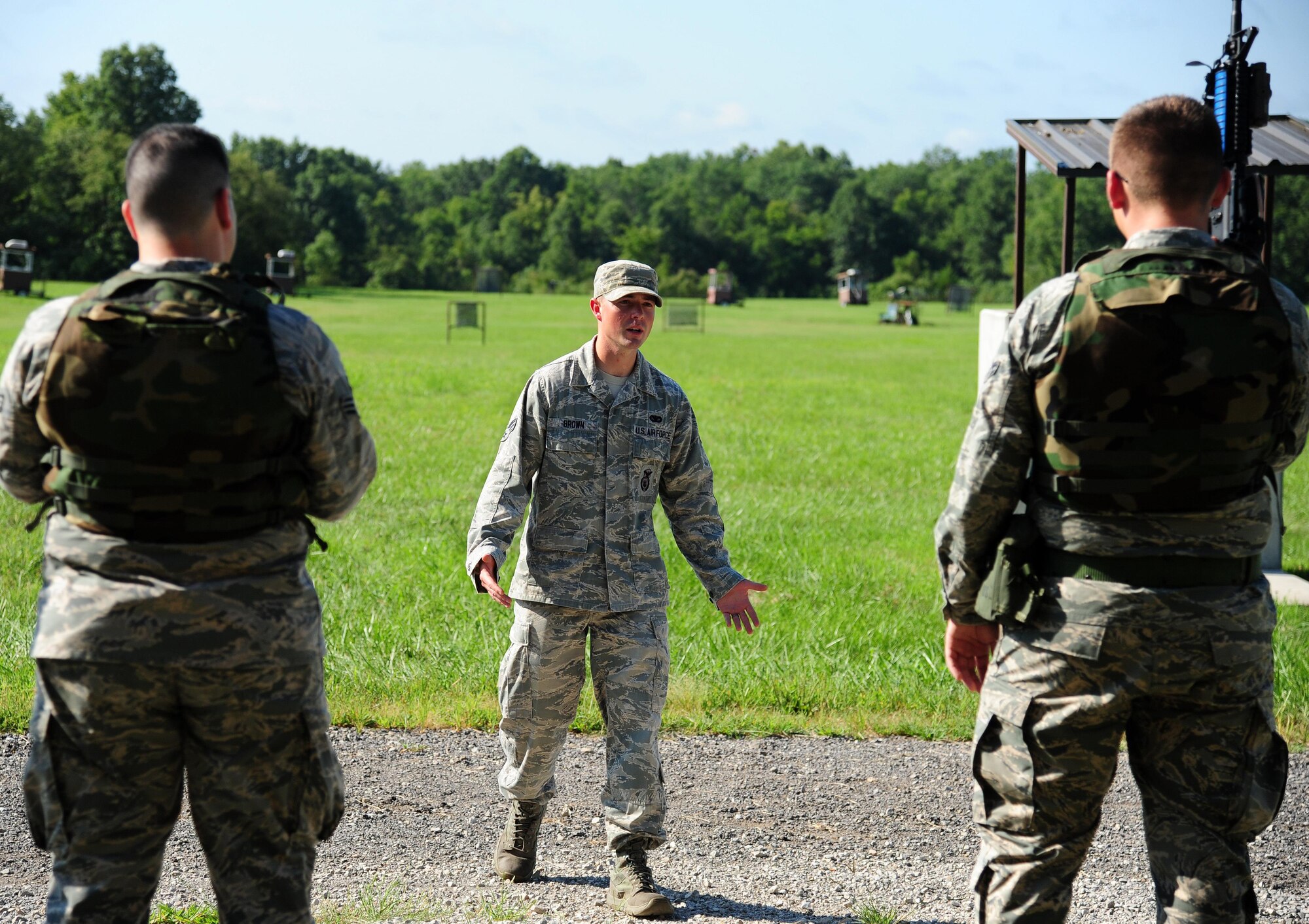 U.S. Air Force Senior Airman Grayson Brown, a 509th Security Forces Squadron (SFS) instructor, teaches Airmen from the 509th Munitions Squadron (MUNS) basic shooting stances and maneuvers at Whiteman Air Force Base, Mo., Aug. 18, 2016. Airmen from the 509th MUNS participated in shoot, move and communicate training conducted by the 509th SFS to become familiar with denial and recapture support during contingency operations. (U.S. Air Force photo by Senior Airman Joel Pfiester)
