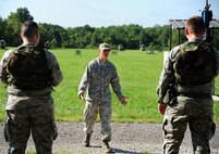 U.S. Air Force Senior Airman Grayson Brown, a 509th Security Forces Squadron (SFS) instructor, teaches Airmen from the 509th Munitions Squadron (MUNS) basic shooting stances and maneuvers at Whiteman Air Force Base, Mo., Aug. 18, 2016. Airmen from the 509th MUNS participated in shoot, move and communicate training conducted by the 509th SFS to become familiar with denial and recapture support during contingency operations. (U.S. Air Force photo by Senior Airman Joel Pfiester)