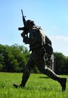 U.S. Air Force Staff Sgt. William Sines, a weapons team chief from the 509th Munitions Squadron, moves to cover during shoot, move and communicate training at Whiteman Air Force Base, Mo., Aug. 18, 2016. The training scenarios provided the Airmen with the basics of how to react during denial and recapture operations in real-world situations. (U.S. Air Force photo by Senior Airman Joel Pfiester)