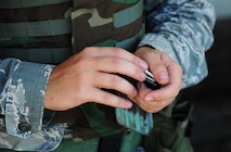 U.S. Air Force Airman 1st Class Joseph Buelt, a weapons team member from the 509th Munitions Squadron (MUNS), loads simulation rounds into a magazine before participating in shoot, move and communicate training at Whiteman Air Force Base, Mo., Aug. 18, 2016. Airmen from the 509th MUNS participated in shoot, move and communicate training conducted by the 509th Security Forces Squadron to become familiar with denial and recapture support during contingency operations. (U.S. Air Force photo by Senior Airman Joel Pfiester)