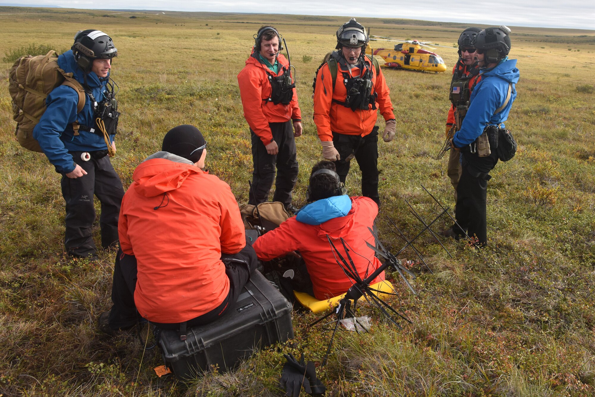 Pararescue jumpers with the 212th Rescue Squadron, Joint Base Elmendorf-Richardson, Alaska, discuss patient evacuation procedures during Exercise Arctic Chinook Aug. 24, 2016.  Exercise Arctic Chinook is a joint U.S. Coast Guard and U.S. Northern Command-sponsored exercise on the U.S. State Department approved list of Arctic Council Chairmanship events. The Arctic mass rescue operation exercise scenario consisted of an adventure-class cruise ship with approximately 200 passengers and crew that experience a catastrophic event with the need to abandon ship. Arctic Chinook exercised elements of the Arctic Search and Rescue Agreement to include interoperability, cooperation, information sharing, SAR services, and joint exercise review. 