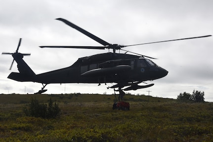 An Alaska Guard UH-60 Blackhawk helicopter picks up medical gear during Exercise Arctic Chinook Aug. 24, 2016.  Exercise Arctic Chinook is a joint U.S. Coast Guard and U.S. Northern Command-sponsored exercise on the U.S. State Department approved list of Arctic Council Chairmanship events. The Arctic mass rescue operation exercise scenario consisted of an adventure-class cruise ship with approximately 200 passengers and crew that experience a catastrophic event with the need to abandon ship. Arctic Chinook exercised elements of the Arctic Search and Rescue Agreement to include interoperability, cooperation, information sharing, SAR services, and joint exercise review. 