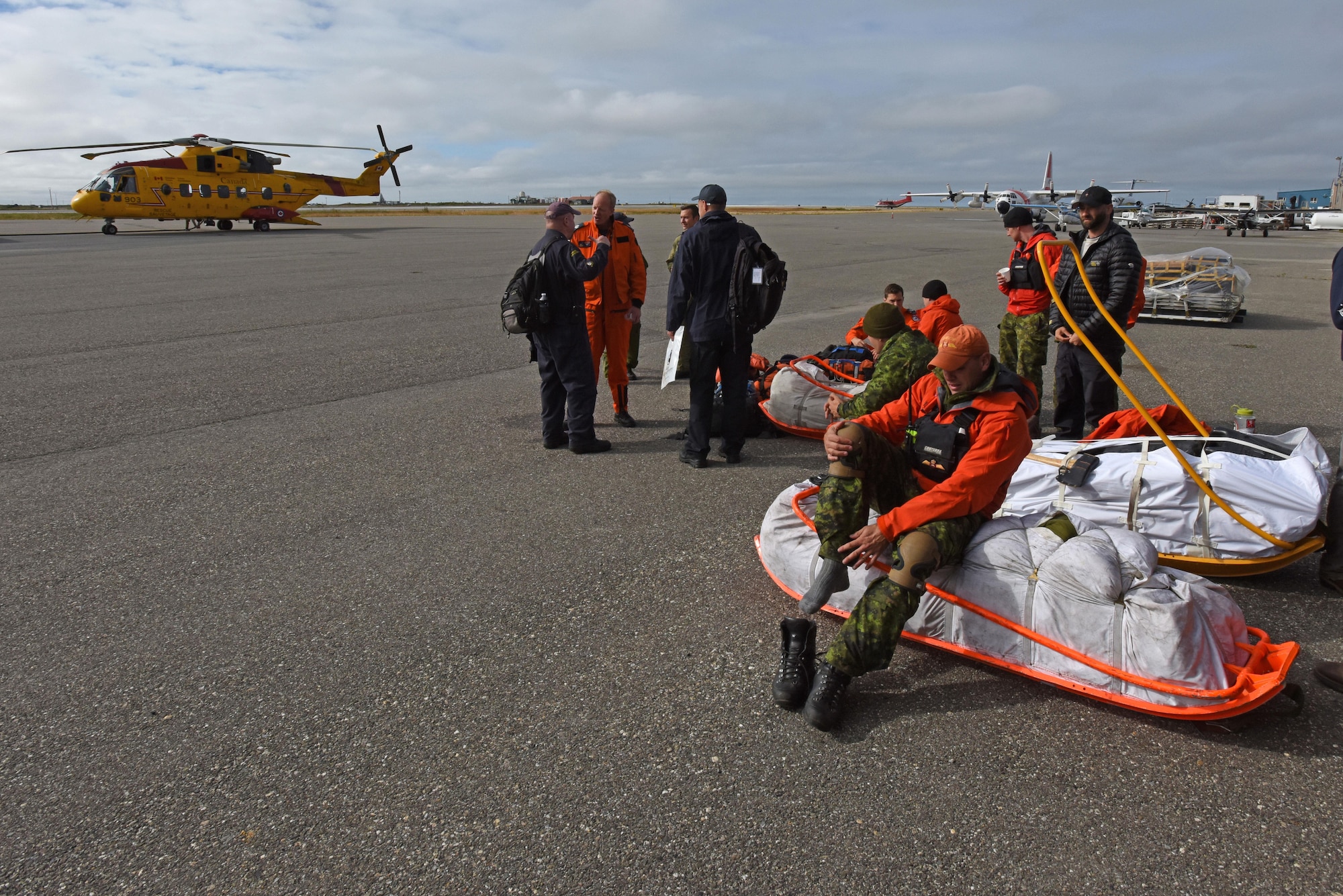 Royal Canadian Airmen prepare to disembark during Exercise Arctic Chinook Aug. 24, 2016.  Exercise Arctic Chinook is a joint U.S. Coast Guard and U.S. Northern Command-sponsored exercise on the U.S. State Department approved list of Arctic Council Chairmanship events. The Arctic mass rescue operation exercise scenario consisted of an adventure-class cruise ship with approximately 200 passengers and crew that experience a catastrophic event with the need to abandon ship. Arctic Chinook exercised elements of the Arctic Search and Rescue Agreement to include interoperability, cooperation, information sharing, SAR services, and joint exercise review. 