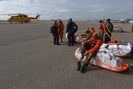 Royal Canadian Airmen prepare to disembark during Exercise Arctic Chinook Aug. 24, 2016.  Exercise Arctic Chinook is a joint U.S. Coast Guard and U.S. Northern Command-sponsored exercise on the U.S. State Department approved list of Arctic Council Chairmanship events. The Arctic mass rescue operation exercise scenario consisted of an adventure-class cruise ship with approximately 200 passengers and crew that experience a catastrophic event with the need to abandon ship. Arctic Chinook exercised elements of the Arctic Search and Rescue Agreement to include interoperability, cooperation, information sharing, SAR services, and joint exercise review. 