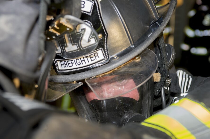 Senior Airman Ian Gonzalez, 512th Civil Engineer Squadron firefighter, visually inspects a fellow firefighter before entering a building during exercise Patriot Warrior Aug. 17, 2016, Sparta/Fort McCoy Airport, Wis. Patriot Warrios allows Gonzalez, who is stationed at Dover Air Force Base, to train with other Air Force firefighting teams throughout the united states in a deployment-style environment. (U.S. Air Force Photo/Tech. Sgt. Nathan Rivard)