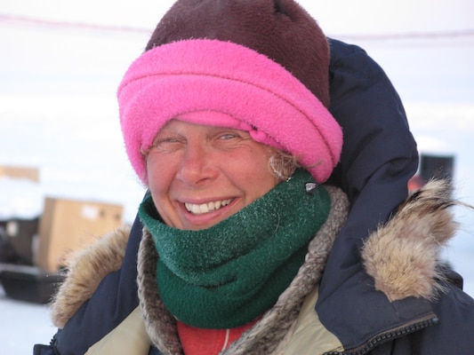 Dr. Jackie Richter-Menge in the field wearing her signature pink hat, a distinguishing feature when she is in the field.