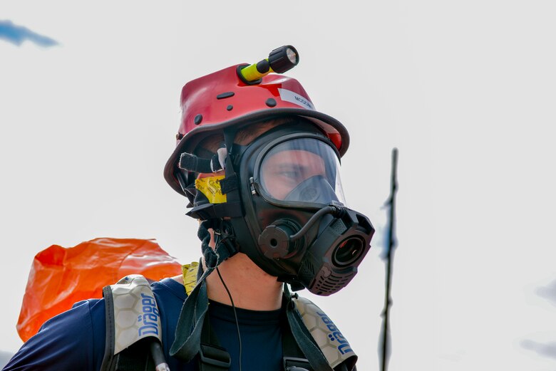 U.S. Air Force Senior Airman Eric McComb, an Alaska Air National Guardsman and Chemical, Biological, Radiological and Nuclear (CBRN) specialist with the Alaska National Guard’s 103rd Weapons of Mass Destruction-Civil Support Team (WMD-CST) out of Kulis Air National Guard Base, Alaska, prepares to don his containment suit Aug. 23, 20116, at the Fairbanks Regional Fire Training Center in Fairbanks, Alaska. The 103rd WMD-CST was established to deploy rapidly to assist a local incident commander in determining the nature and extent of an attack or incident; and help identify and support the arrival of follow-on state and federal military response assets. (U.S. Air Force photo by Airman Isaac Johnson)
