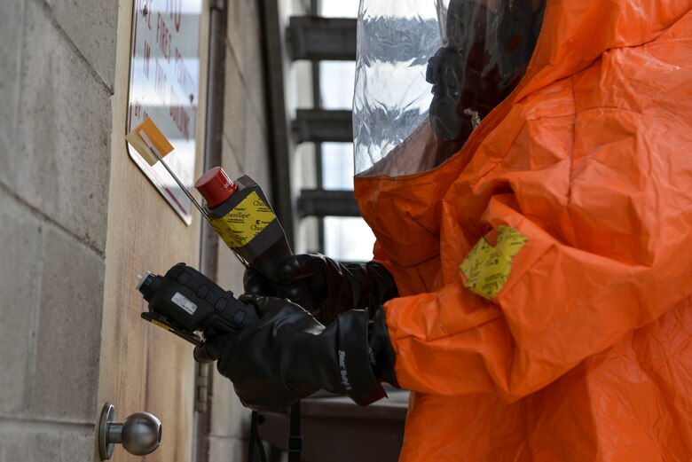 U.S. Army Staff Sgt. Andrew Markham, an Alaska Army National Guard Chemical, Biological, Radiological and Nuclear noncommissioned officer assigned to the 103rd Weapons of Mass Destruction-Civil Support Team out of Kulis Air National Guard Base, Alaska, checks a door for harmful substances during an exercise Aug. 23, 2016, at the Fairbanks Regional Fire Training Center in Fairbanks, Alaska. Air monitors with different sensors are used to check for various substances in the air. (U.S. photo by Air Force Airman Isaac Johnson)
