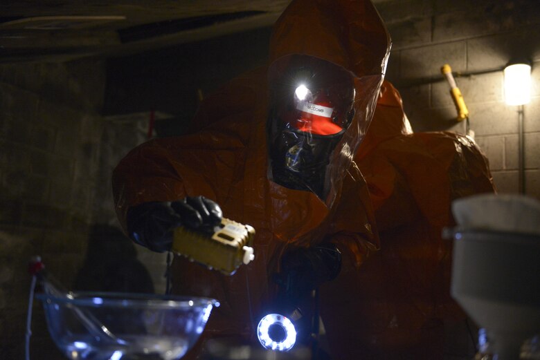 U.S. Air Force Senior Airman Eric McComb, an Alaska Air National Guard Chemical, Biological, Radiological and Nuclear (CBRN) technician assigned to the 103rd Weapons of Mass Destruction-Civil Support Team out of Kulis Air National Guard Base, Alaska, uses an air monitor to check for CBRN substances during an exercise Aug. 23, 2016, at the Fairbanks Regional Fire Training Center in Fairbanks, Alaska. In preparation for the exercise, multiple laboratories were staged within the building. (U.S. Air Force photo by Airman Isaac Johnson)
