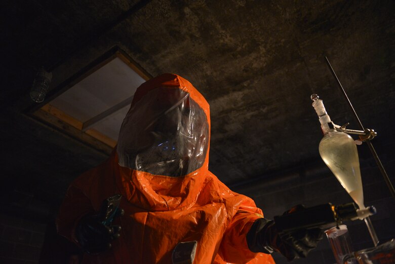 U.S. Army Staff Sgt. Andrew Markham, an Alaska Army National Guard Chemical, Biological, Radiological and Nuclear (CBRN) noncommissioned officer assigned to the 103rd Weapons of Mass Destruction-Civil Support Team out of Kulis Air National Guard Base, Alaska, uses an air monitor to check for CBRN substances during an exercise Aug. 23, 2016, at the Fairbanks Regional Fire Training Center in Fairbanks, Alaska.  In preparation for the exercise, multiple laboratories were staged within the building. (U.S. Air Force photo by Airman Isaac Johnson