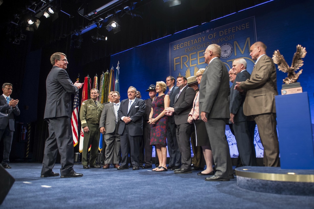Defense Secretary Ash Carter applauds the winners of the 2016 Employer Support Freedom Award at the Pentagon, Aug. 26, 2016. DoD photo by Navy Petty Officer 1st Class Tim D. Godbee