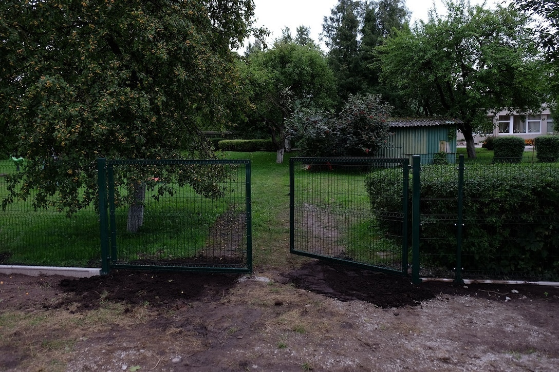 SIAULIAI, Lithuania – Army Reserve Soldiers from the 7th Mission Support Command helped coordinate the construction of a new fence and gate and sign for the local ‘infant’ or ‘baby’ orphanage with USAR Soldiers from the 412th Theater Engineer Command and Lithuanian Soldiers and Airmen and local national contractors, Aug. 8-25, 2016. 
 (Photo by Sgt. 1st Class Matthew Chlosta, 7th MSC Public Affairs Office)