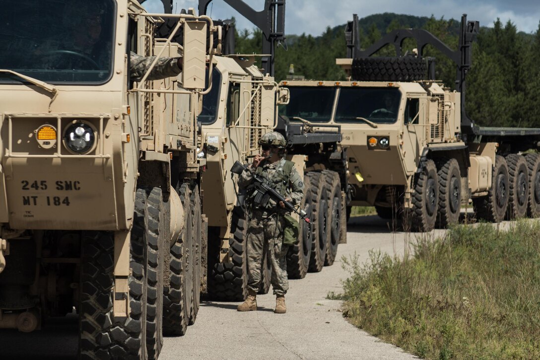 FORT MCCOY, Wis. – A U.S. Army Reserve Soldier, with the 245th Support Maintenance Company from Weldon Spring, Mo., guides the driver of a heavy expanded mobility tactical truck as they prepare to recover another vehicle that has been immobilized by a mock improvised explosive device during a combat support training exercise at Fort McCoy, Wis., Aug. 21, 2016. This HEMTT is equipped with wrecker attachment that allows it to tow another vehicle. (U.S. Army Reserve photo by Sgt. Clinton Massey, 206th Broadcast Operations Detachment)