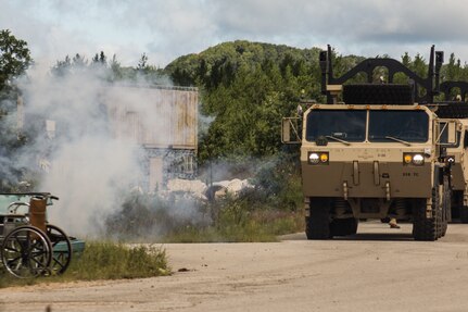 FORT MCCOY, Wis. – A heavy expanded mobility tactical truck delivering humanitarian aid supplies, driven by a U.S. Army Reserve Soldier with the 459th Transportation Company from Elwood, Ill., is immobilized by a mock improvised explosive device during a combat support training exercise at Fort McCoy, Wis., Aug. 21, 2016. (U.S. Army Reserve photo by Sgt. Clinton Massey, 206th Broadcast Operations Detachment)