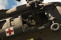 FORT MCCOY, Wis. – A U.S. Army Reserve medic, with F Company, 1st Battalion, 214th Aviation Regiment of Fort Knox, Ky., prepares to exit a UH-60 Black Hawk medical evacuation helicopter to administer emergency first-aid to victims of an oppositional forces attack. The attack was a part of a combat support training exercise at Fort McCoy, Wis., Aug. 21, 2016. (U.S. Army Reserve photo by Sgt. Clinton Massey, 206th Broadcast Operations Detachment)
