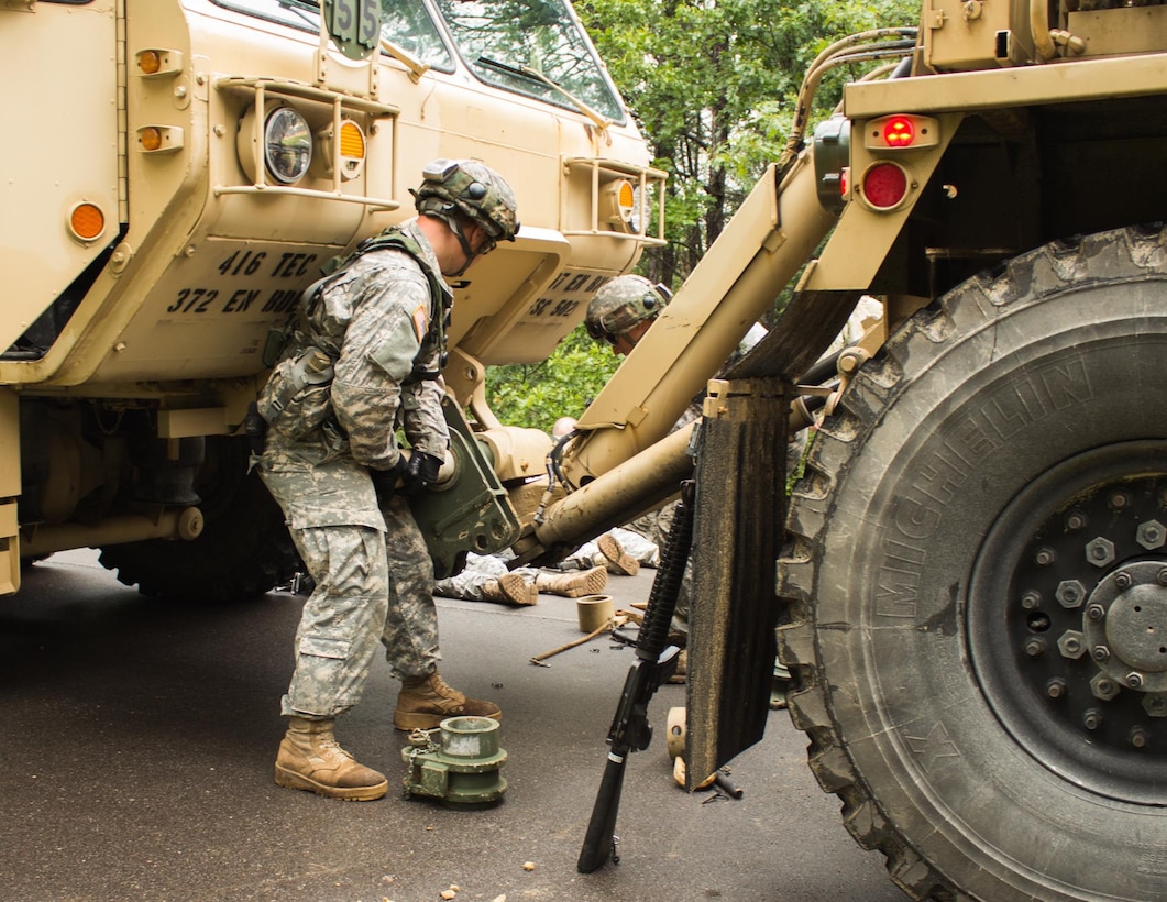 FORT MCCOY, Wis. – U.S. Army Reserve Soldiers, with the 397th Engineering Battalion from Eau Claire, Wis., attach a towing vehicle to a heavy expanded mobility tactical truck that was hit by a mock improvised explosive device Aug. 20, 2016 at Fort McCoy, Wis., during a combat support training exercise. (U.S. Army Reserve photo by Sgt. Clinton Massey, 206th Broadcast Operations Detachment)