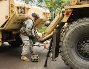 FORT MCCOY, Wis. – U.S. Army Reserve Soldiers, with the 397th Engineering Battalion from Eau Claire, Wis., attach a towing vehicle to a heavy expanded mobility tactical truck that was hit by a mock improvised explosive device Aug. 20, 2016 at Fort McCoy, Wis., during a combat support training exercise. (U.S. Army Reserve photo by Sgt. Clinton Massey, 206th Broadcast Operations Detachment)