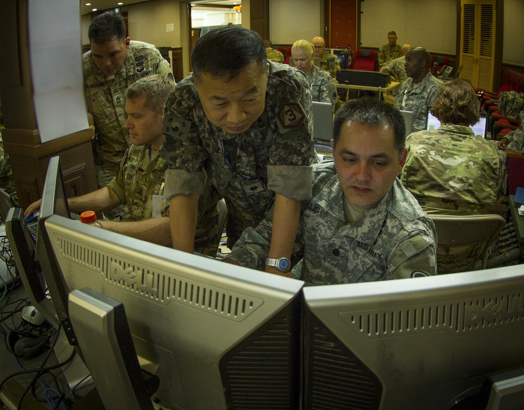 U.S. Army Lt. Col. Troy Ellis (right), the deputy of civil military operations for I Corps, and Korean Army Lt. Col. Seunghoon Lee, Third Republic of Korea Army liaison officer, work together at Yongin, South Korea during a two-week training exercise, Aug 24, 2016. (U.S. Army photo by Staff Sgt. Ken Scar)