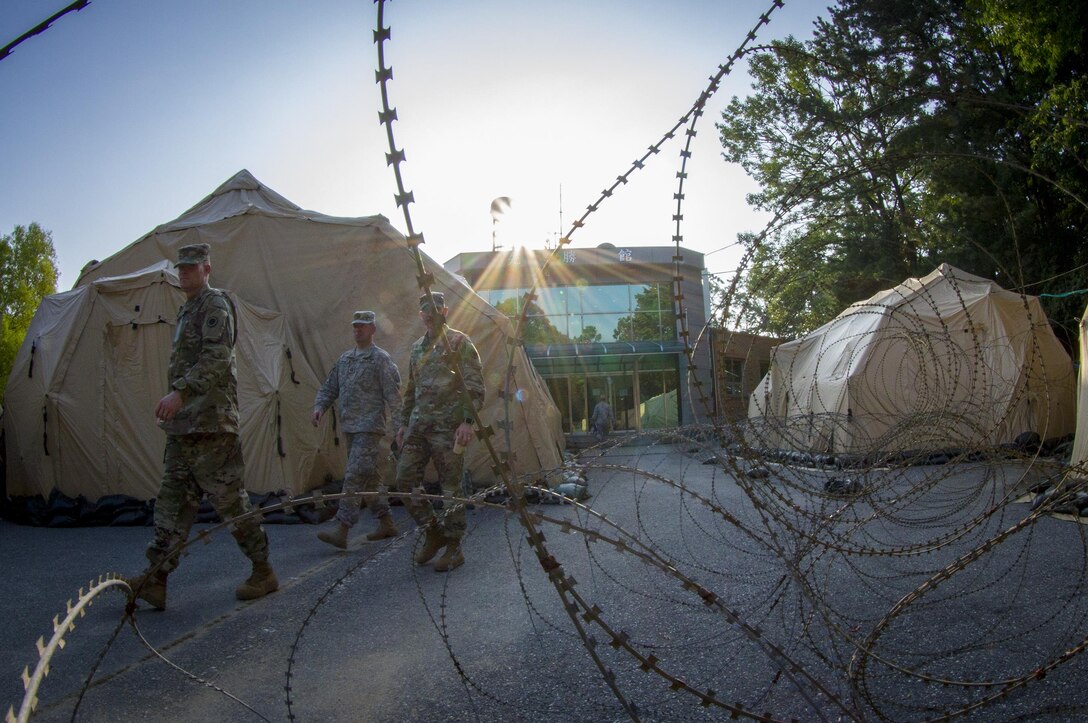 U.S. Army Soldiers exit an operations center at Yongin, South Korea, Aug. 25, 2016.  (U.S. Army photo by Staff Sgt. Ken Scar)