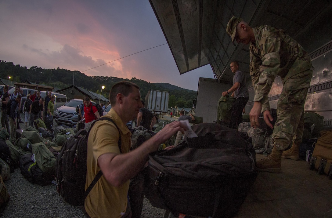 U.S. Army Soldiers with I Corps unload their luggage and equipment upon arriving at Yongin, South Korea, after nearly 24 hours of travel, security lines and briefings to participate in a two-week training exercise, Aug. 22, 2016. (U.S. Army photo by Staff Sgt. Ken Scar)