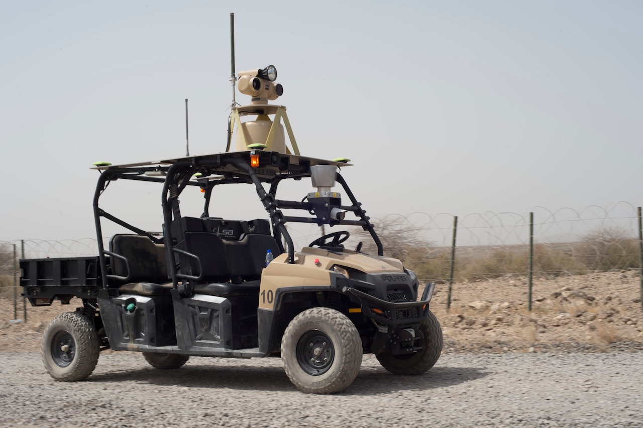 A mobile detection assessment response system patrols the perimeter of an airfield in Djibouti, July 9, 2016. It is an automated patrol vehicle able to navigate paths and detect threats in the vicinity. Air Force photo by Staff Sgt. Eric Summers Jr.