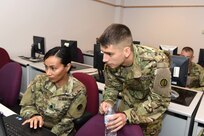 Second Lt. Seth Lionberger, right, Information Management Officer, 85th Support Command, provides instruction to Lt. Col. Vickie Argueta, equal opportunity officer, during a blackberry training class at the command's battle assembly weekend, Aug. 6, 2016. Blackberry devices were recently updated for section leaders as part of their lifecycle replacement. The lifecycle replacement assists with up-to-date security and a uniformed operating system across the formation.
(Photo by Spc. David Lietz)